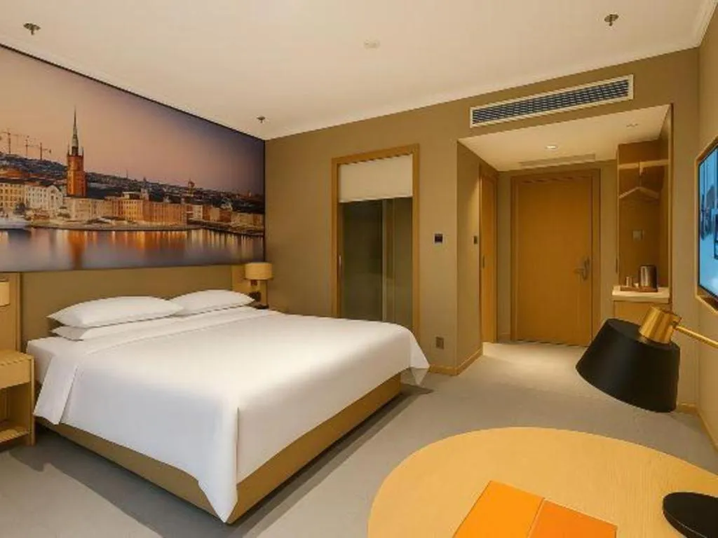 Bed in Vienna Hotel Jiangsu Dongtai Wanghai West Road