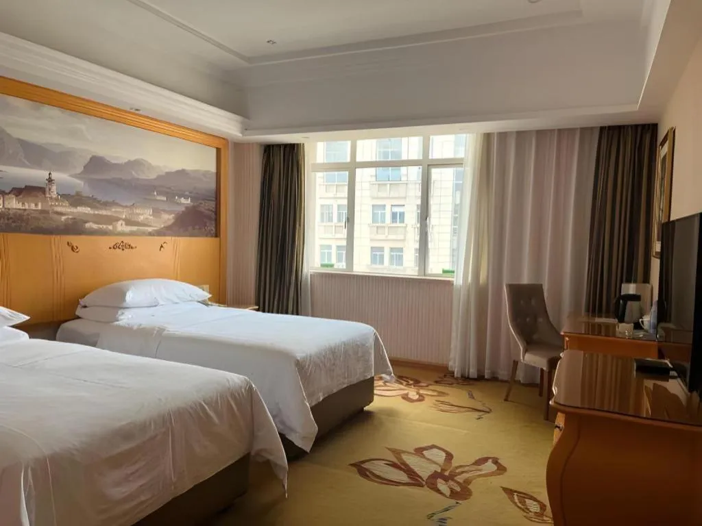 Bed in Vienna Hotel Guangdong Zhongshan Caihong Avenue