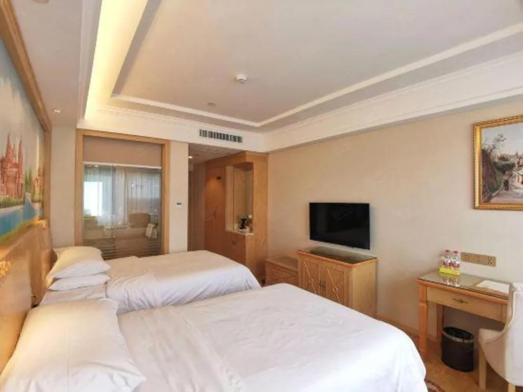 Bed in Vienna Hotel Shenzhen Window of the World Qiaochengdong Metro Station