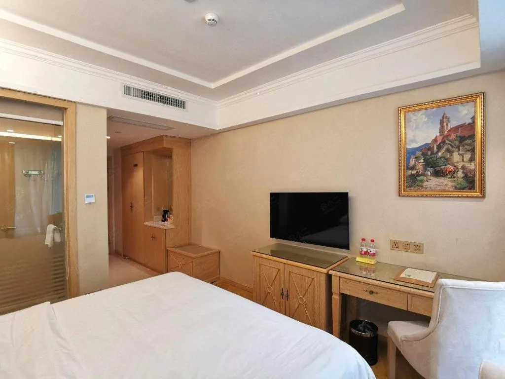 Bed in Vienna Hotel Shenzhen Window of the World Qiaochengdong Metro Station