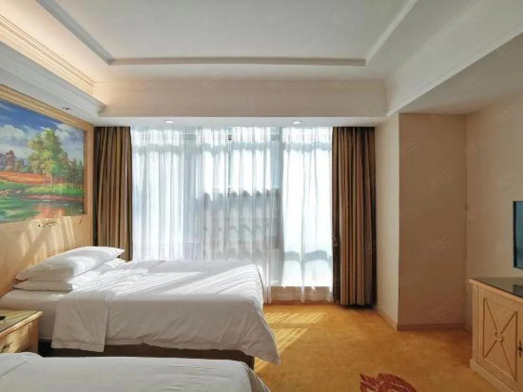 Bed in Vienna Hotel Shenzhen Window of the World Qiaochengdong Metro Station