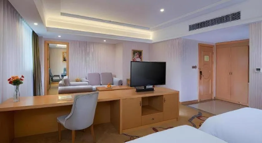 Bed in Vienna Hotel Guangdong Meizhou Fengshun