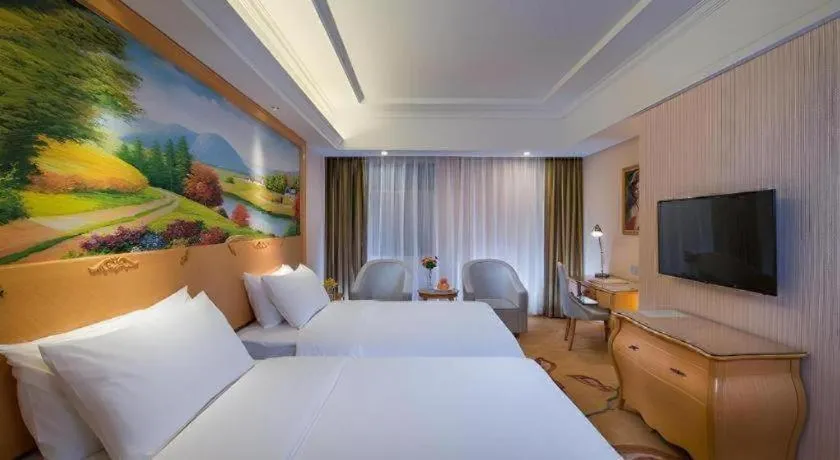Bed in Vienna Hotel Guangdong Meizhou Fengshun