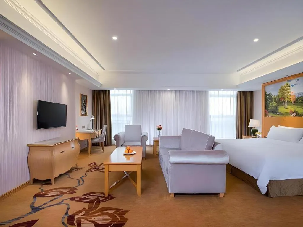 Bed in Vienna Hotel Guangdong Meizhou Fengshun