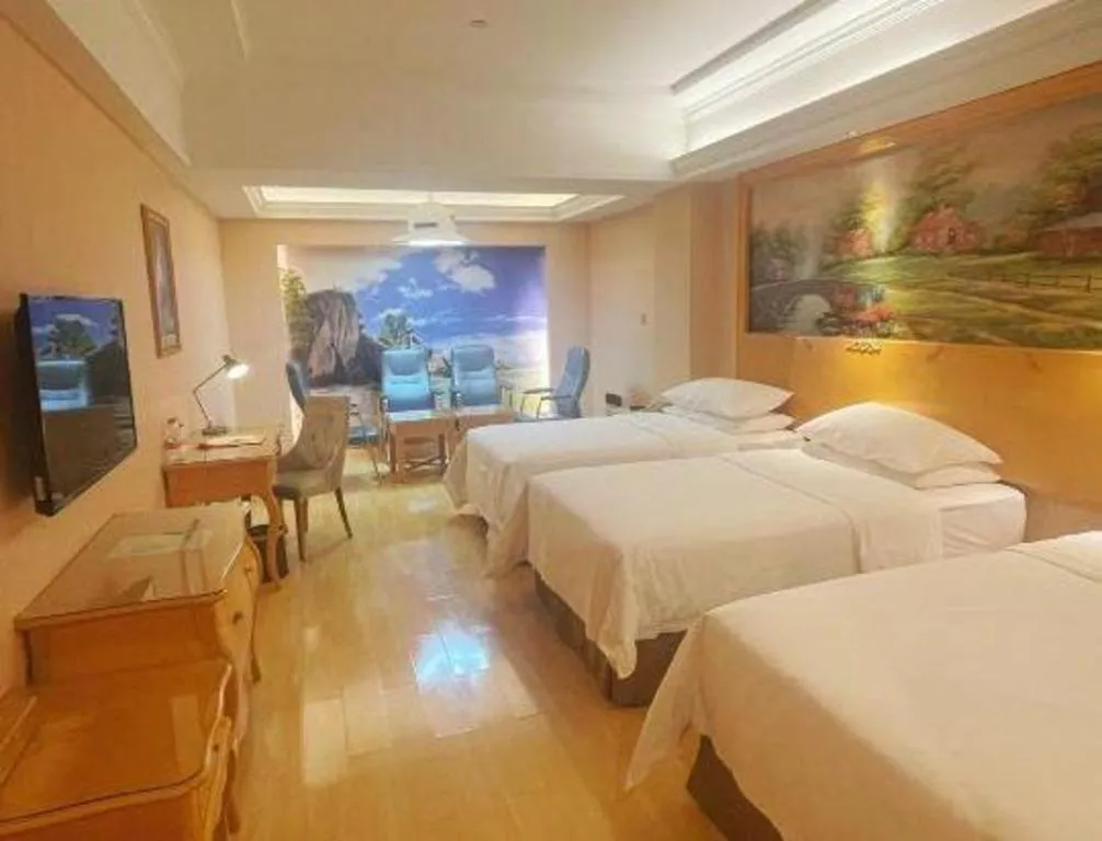 Bed in Vienna Hotel Guangdong Meizhou Fengshun