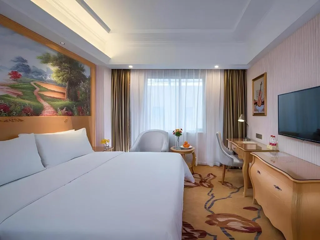 Bed in Vienna Hotel Guangdong Meizhou Fengshun