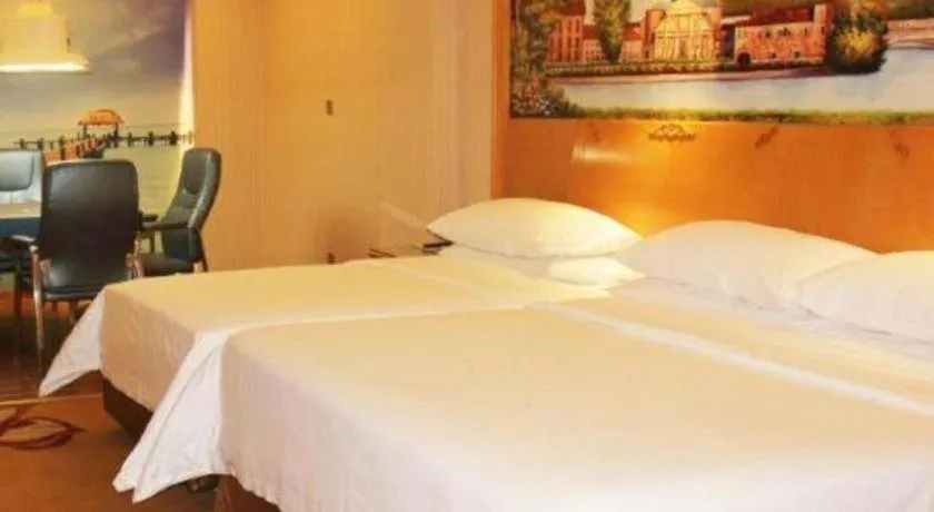 Bed in Vienna Hotel Guangdong Meizhou Fengshun