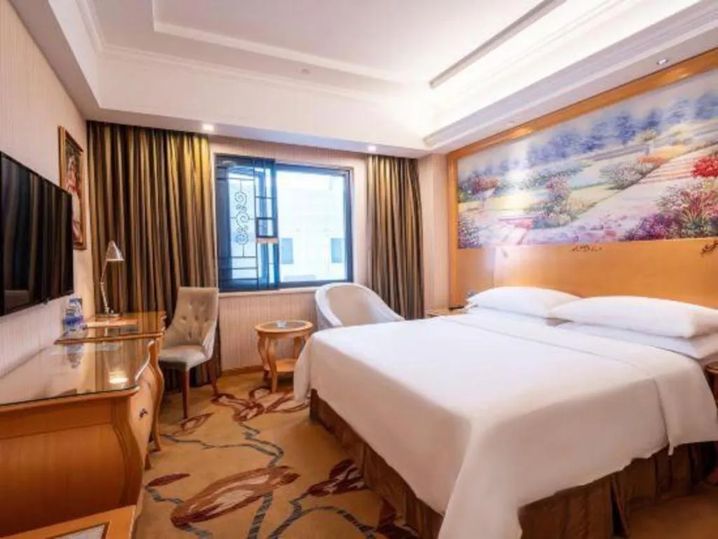 Bed in Vienna Hotel Guangdong Meizhou Fengshun