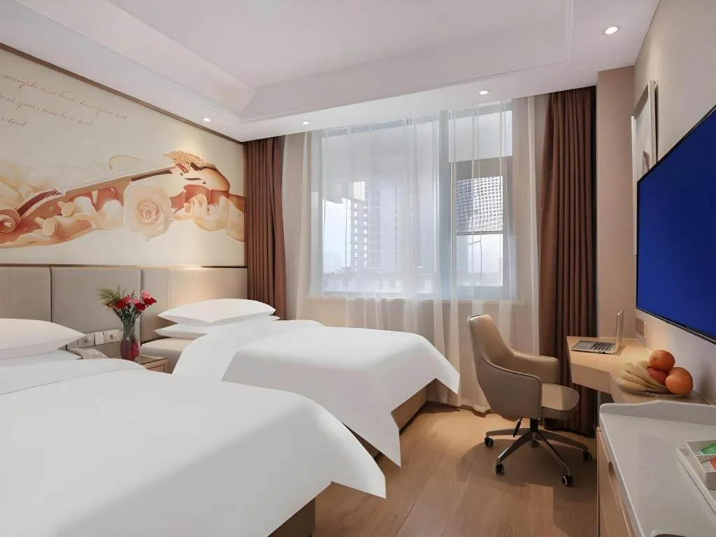 Bed in Vienna Hotel Shaanxi Xianyang Huitong China Square