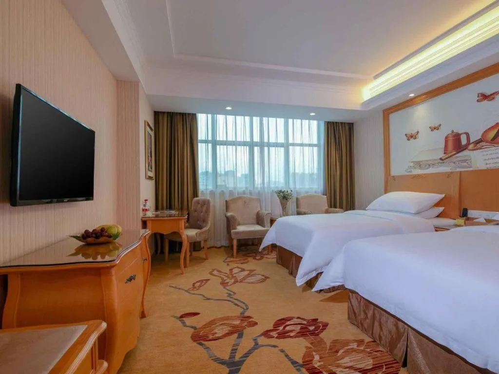 Bed in Vienna Hotel Guangdong Huiyang Qiuchang Yingbin Road