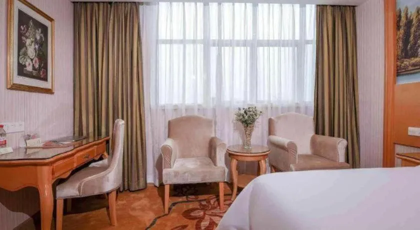 Bed in Vienna Hotel Guangdong Huiyang Qiuchang Yingbin Road