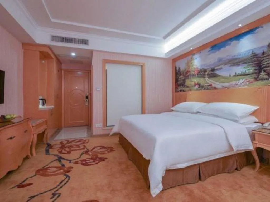 Bed in Vienna Hotel Guangdong Huiyang Qiuchang Yingbin Road