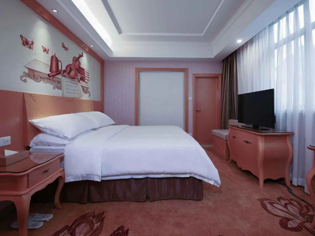 Bed in Vienna Hotel Guangdong Huiyang Qiuchang Yingbin Road