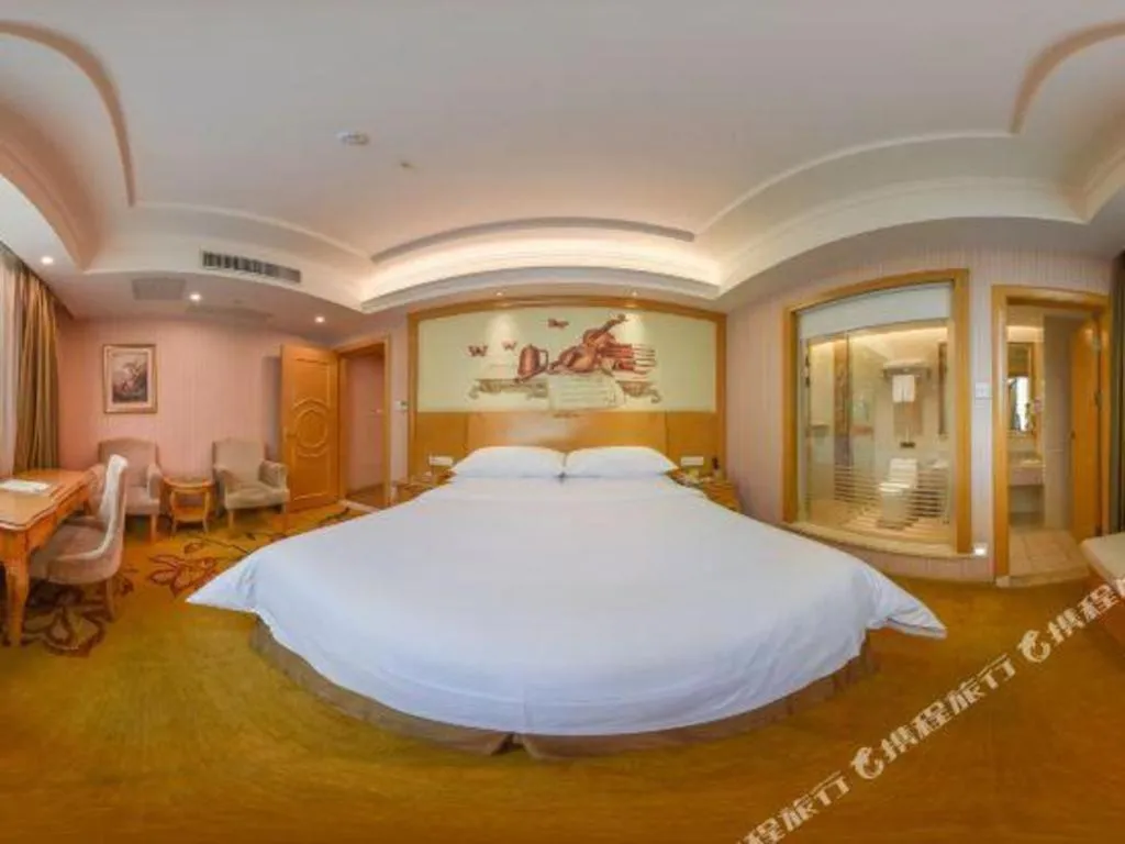 Bed in Vienna Hotel Guangdong Huiyang Qiuchang Yingbin Road