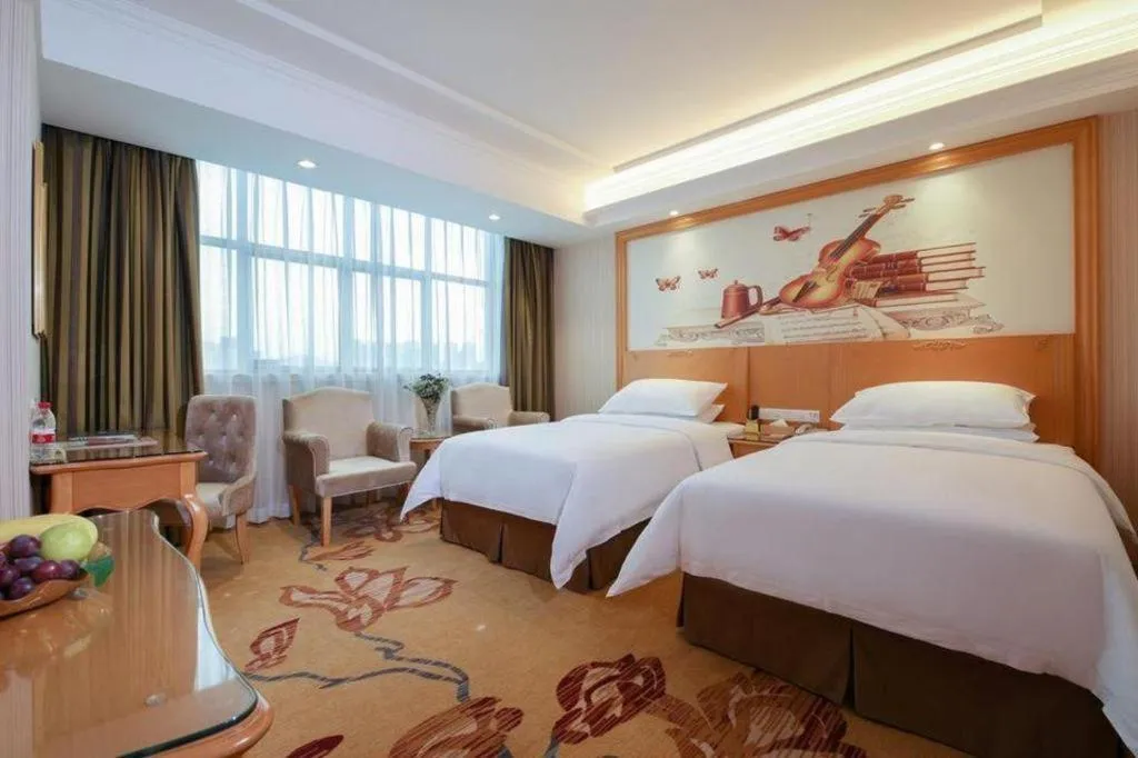 Bed in Vienna Hotel Guangdong Huiyang Qiuchang Yingbin Road