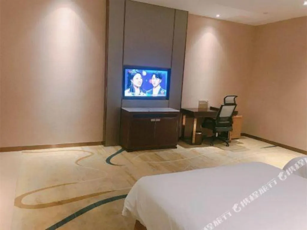 Bed in Venus Royal Hotel Nanning East High-Speed Railway Station