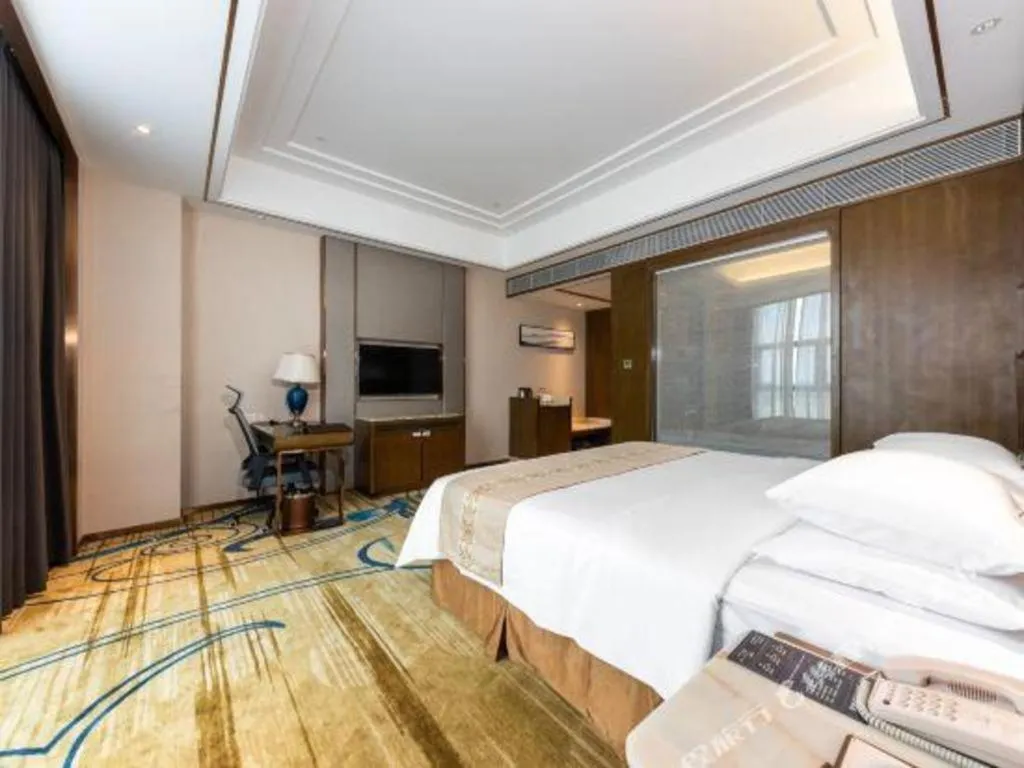 Bed in Venus Royal Hotel Nanning East High-Speed Railway Station