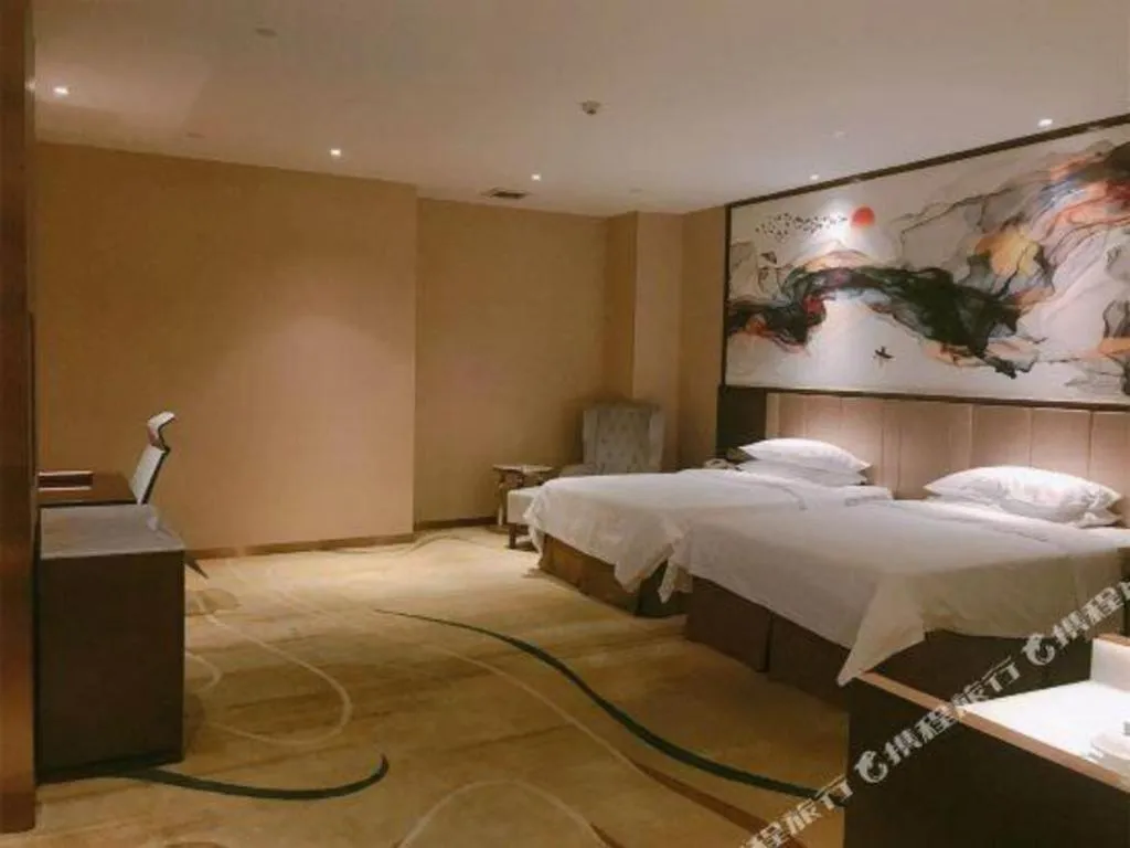 Bed in Venus Royal Hotel Nanning East High-Speed Railway Station