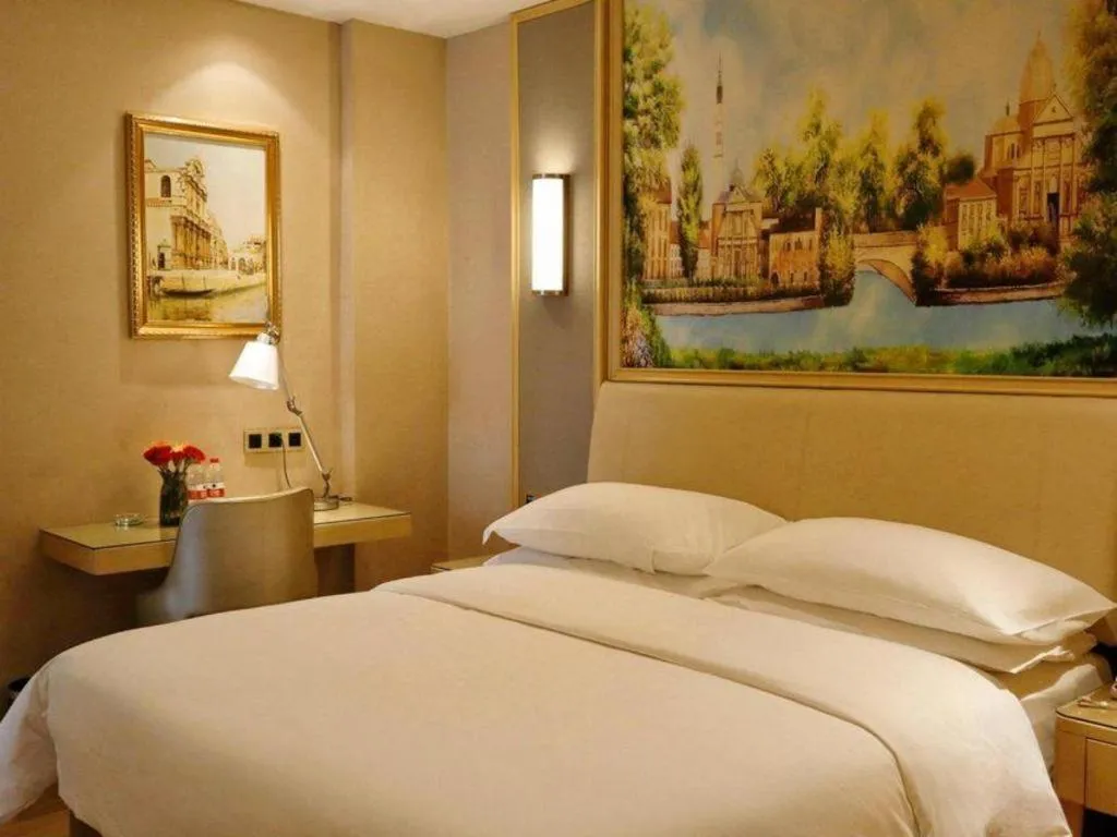 Bed in Vienna Hotel Guangdong Zhaoqing East Station Dinghu Mountain Scenic Area