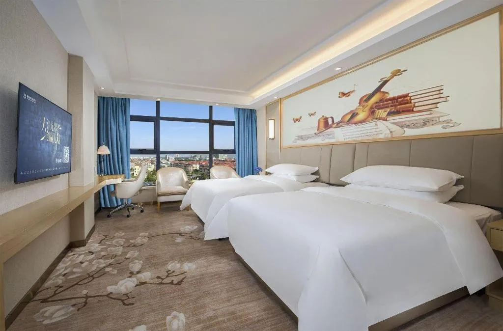 Bed in Vienna Hotel Guangdong Zhaoqing East Station Dinghu Mountain Scenic Area