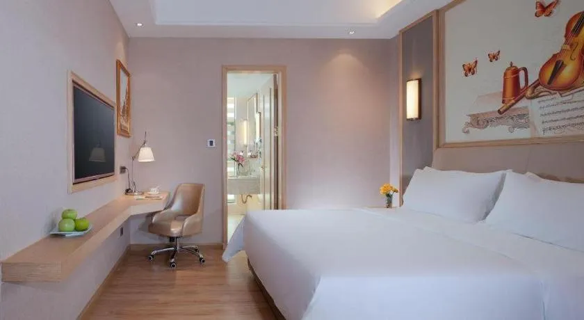 Bed in Vienna Hotel Guangdong Zhaoqing East Station Dinghu Mountain Scenic Area