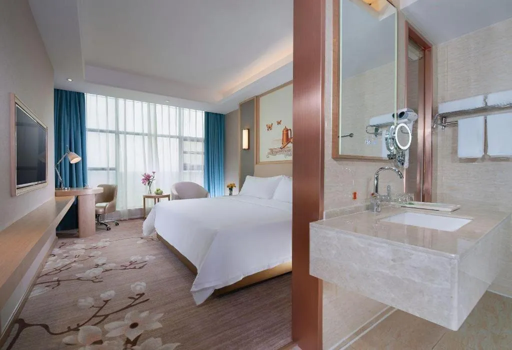 Bed in Vienna Hotel Guangdong Zhaoqing East Station Dinghu Mountain Scenic Area