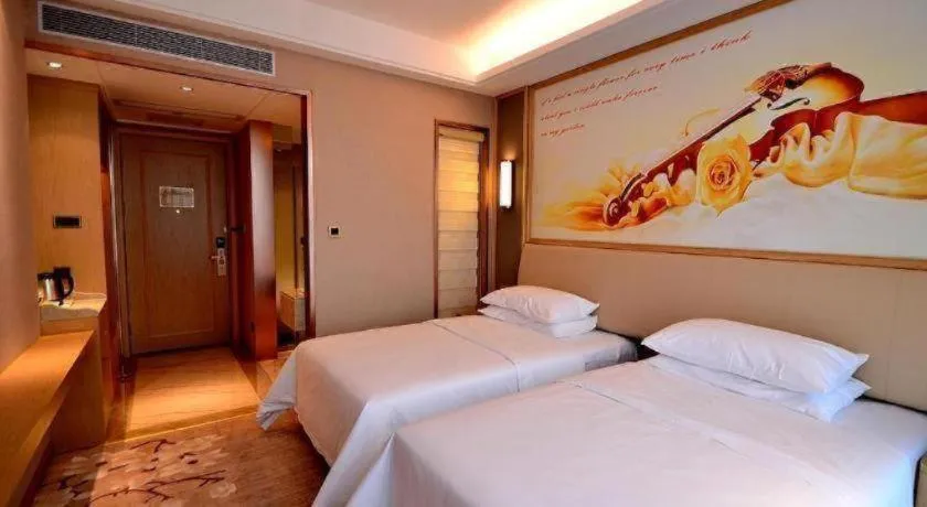 Bed in Vienna Hotel Guangdong Zhaoqing East Station Dinghu Mountain Scenic Area