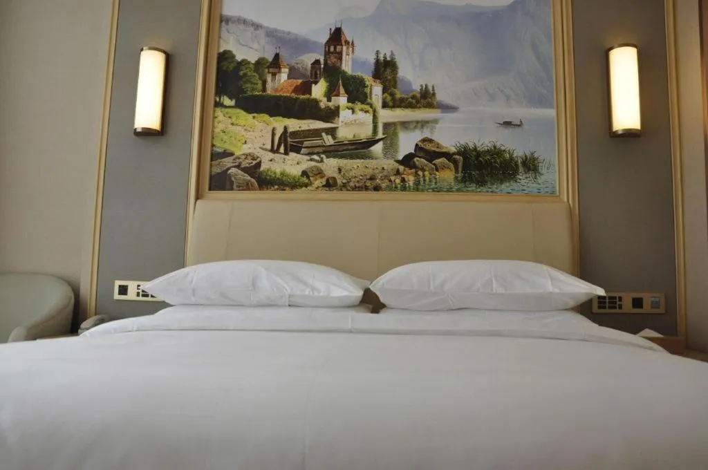 Bed in Vienna Hotel Guangdong Zhaoqing East Station Dinghu Mountain Scenic Area