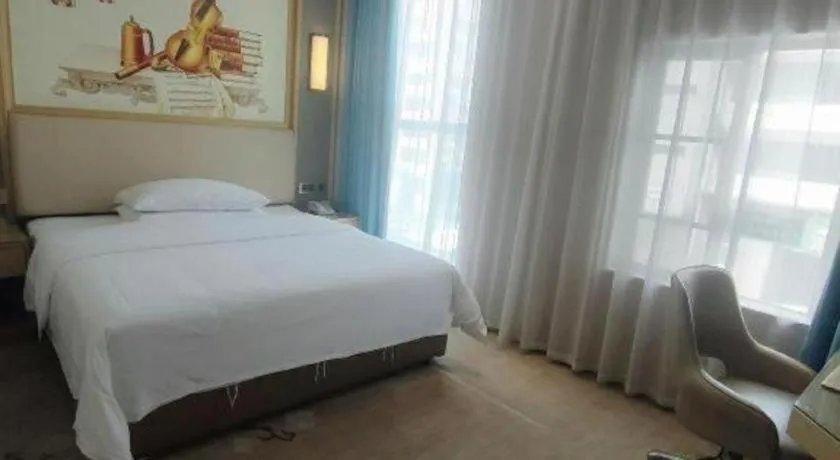 Bed in Vienna Hotel Guangdong Zhaoqing East Station Dinghu Mountain Scenic Area