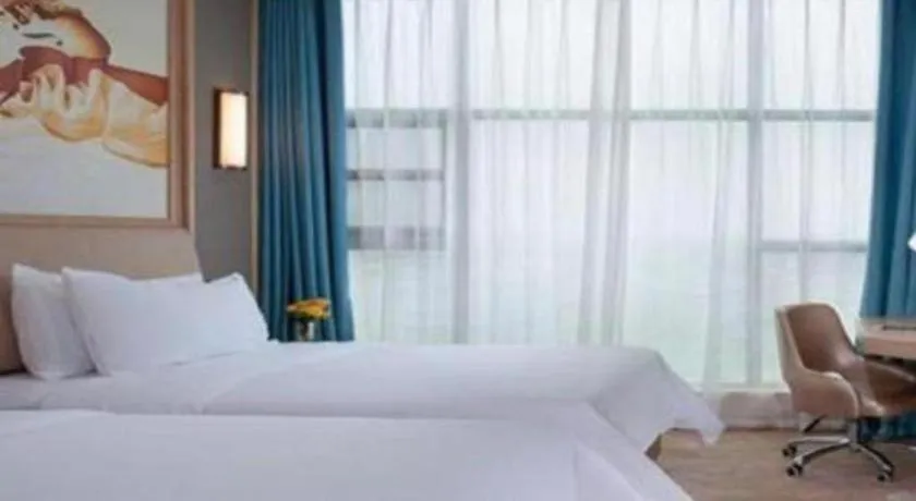 Bed in Vienna Hotel Guangdong Zhaoqing East Station Dinghu Mountain Scenic Area