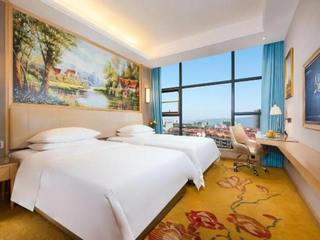 Bed in Vienna Hotel Guangdong Zhaoqing East Station Dinghu Mountain Scenic Area
