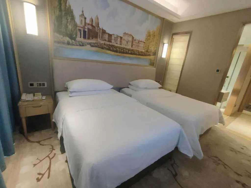 Bed in Vienna Hotel Guangdong Zhaoqing East Station Dinghu Mountain Scenic Area
