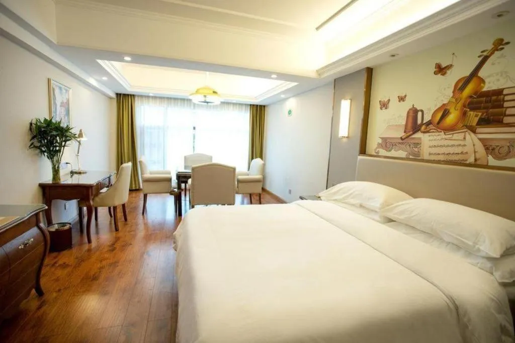 Bed in Vienna Hotel Jiangxi Fuzhou Lichuan Kangshu