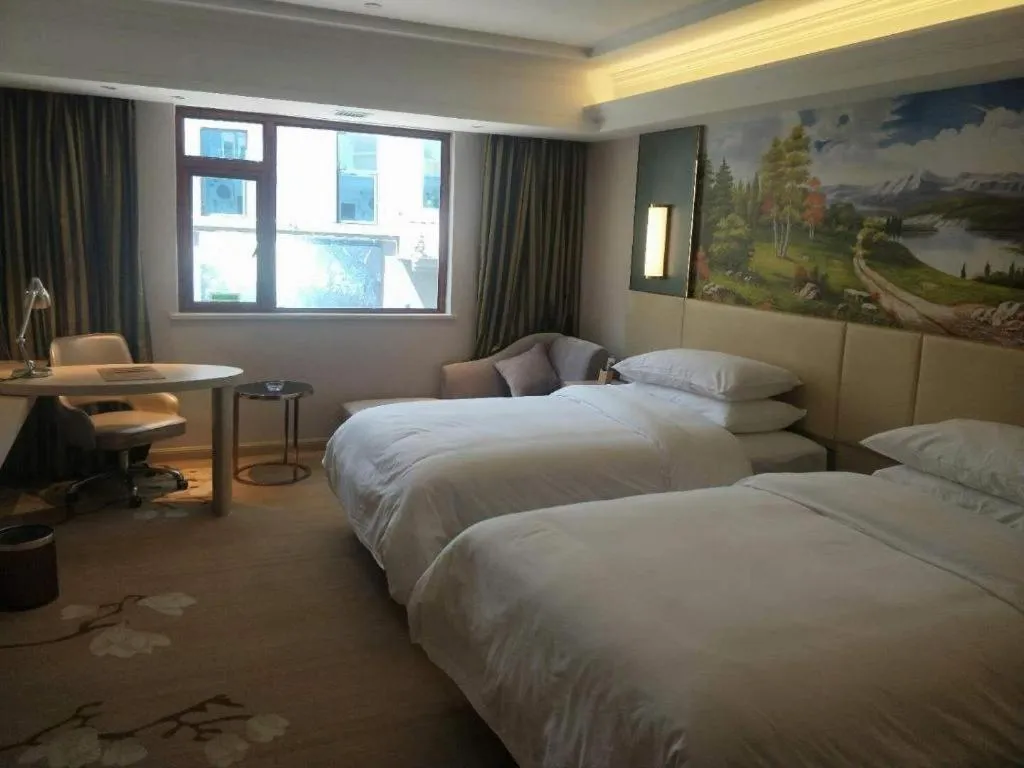 Bed in Vienna Hotel Yunnan Lijiang Ancient City