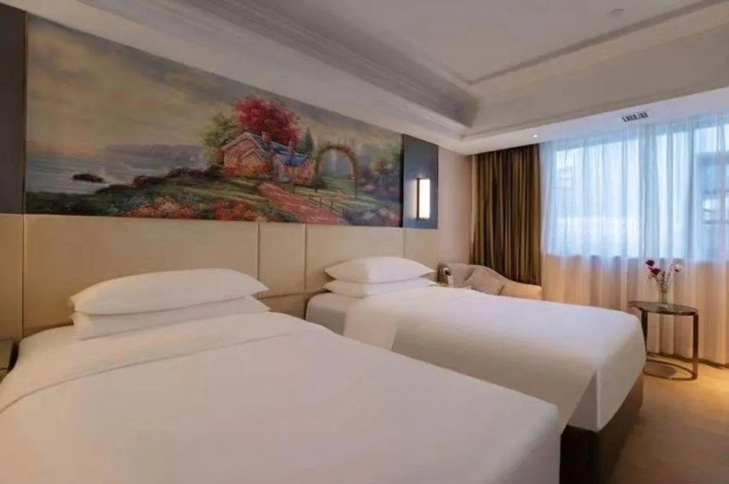 Bed in Vienna Hotel Yunnan Lijiang Ancient City