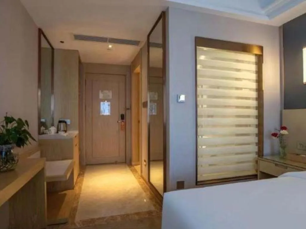 Bed in Vienna Hotel Yunnan Lijiang Ancient City