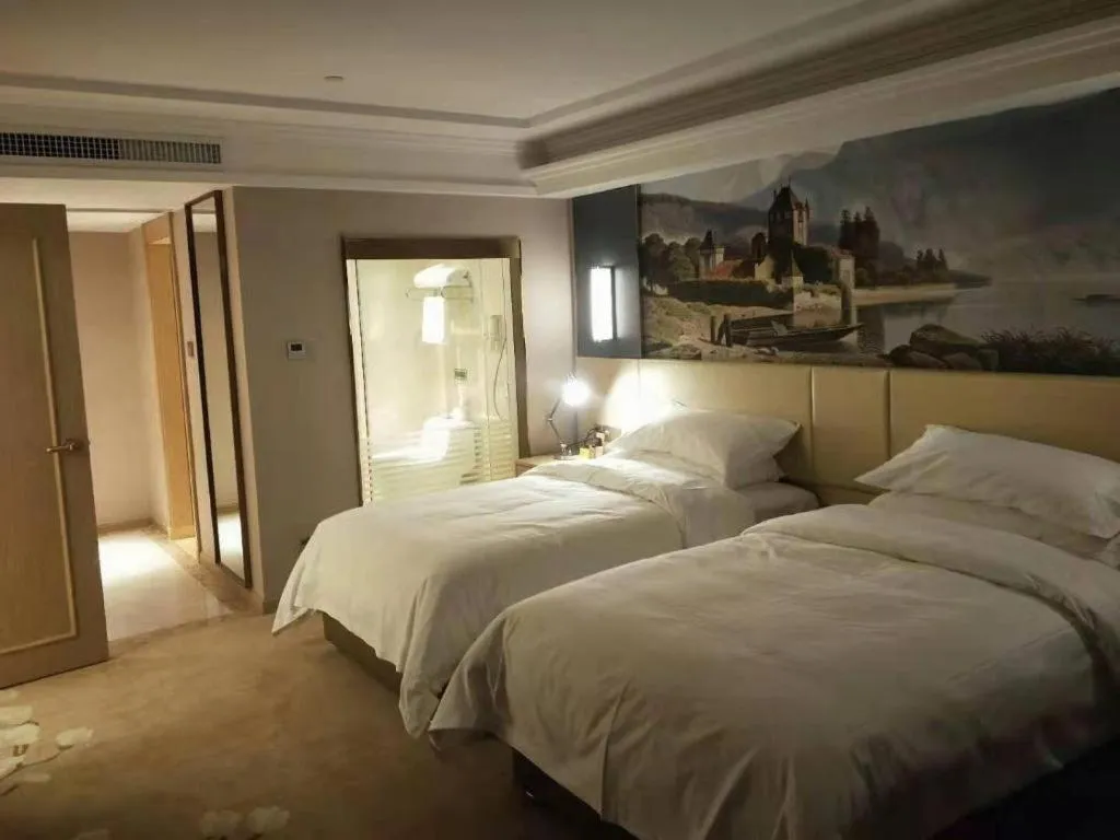 Bed in Vienna Hotel Yunnan Lijiang Ancient City