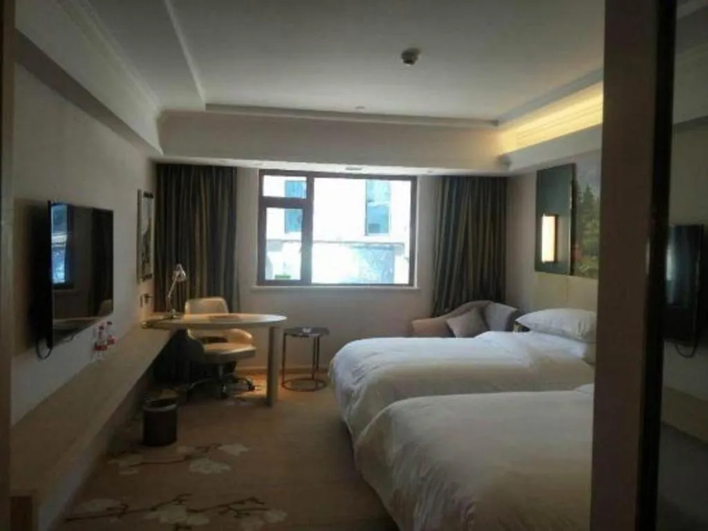 Bed in Vienna Hotel Yunnan Lijiang Ancient City