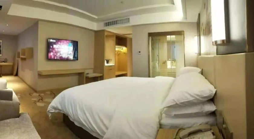 Bed in Vienna Hotel Yunnan Lijiang Ancient City