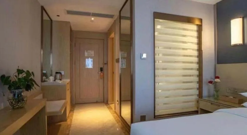 Bed in Vienna Hotel Yunnan Lijiang Ancient City