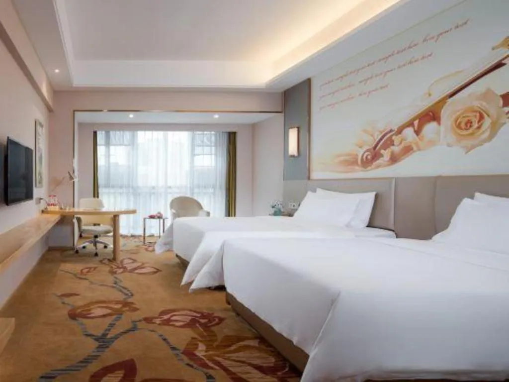 Bed in Vienna Hotel Yunnan Lijiang Ancient City