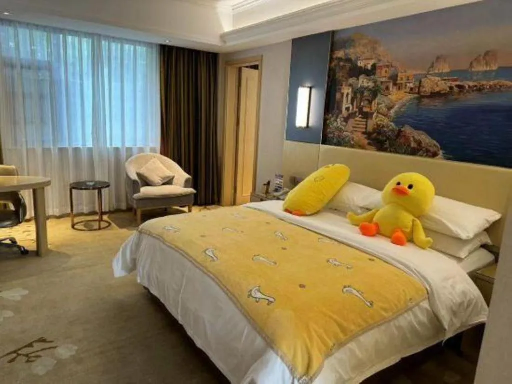 Bed in Vienna Hotel Yunnan Lijiang Ancient City