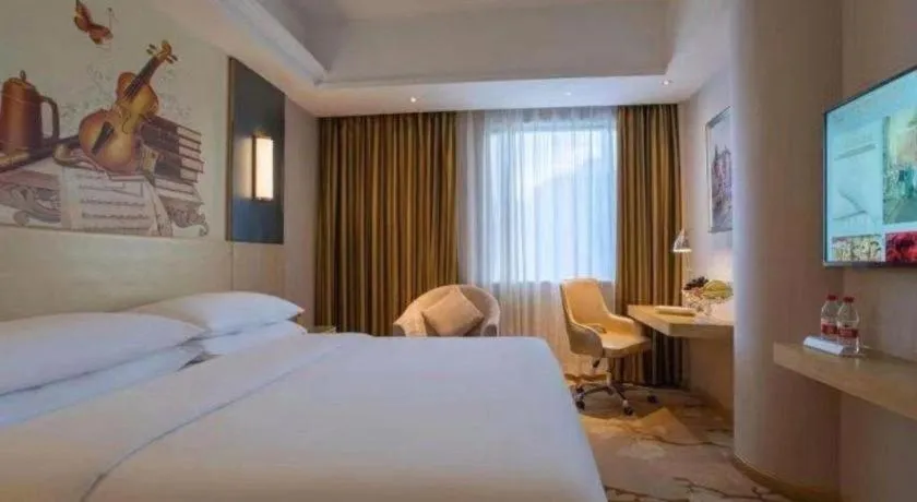 Bed in Vienna Hotel Yunnan Lijiang Ancient City