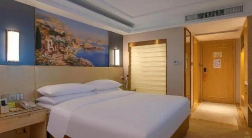 Bed in Vienna Hotel Yunnan Lijiang Ancient City