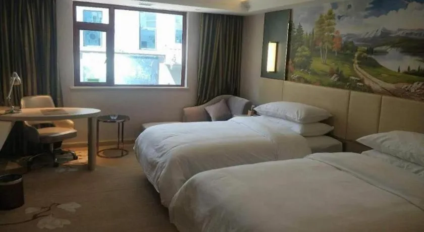 Bed in Vienna Hotel Yunnan Lijiang Ancient City