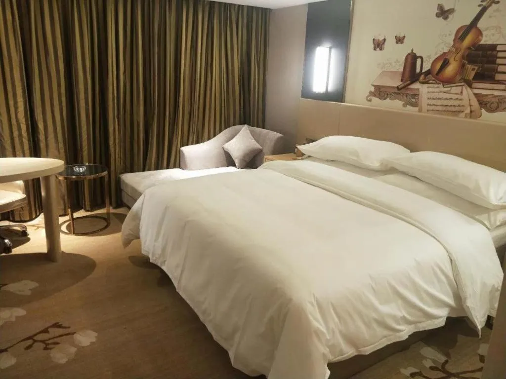 Bed in Vienna Hotel Yunnan Lijiang Ancient City