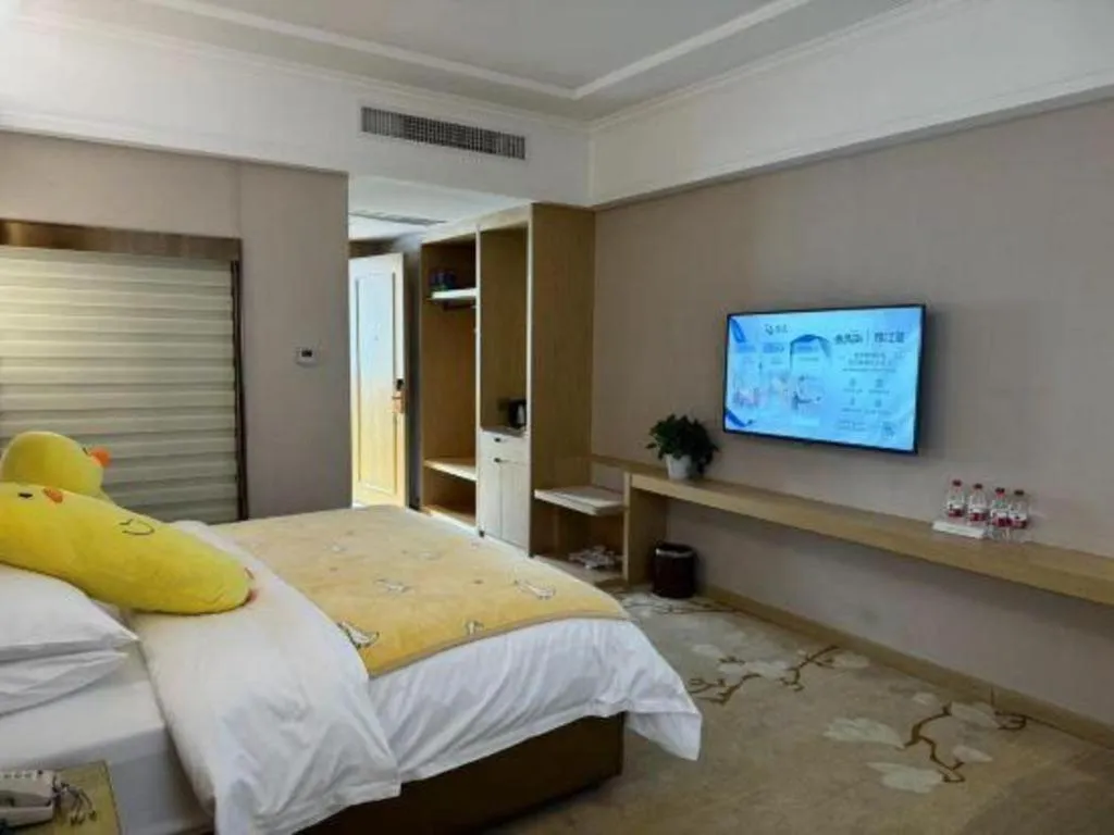 Bed in Vienna Hotel Yunnan Lijiang Ancient City