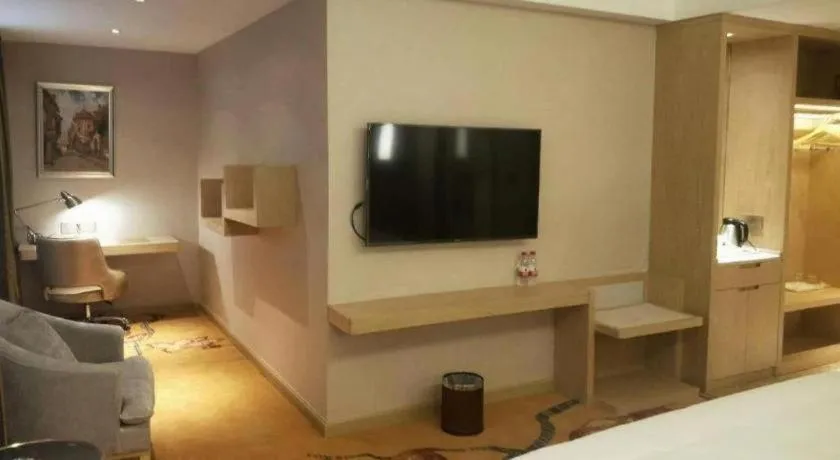 Bed in Vienna Hotel Yunnan Lijiang Ancient City