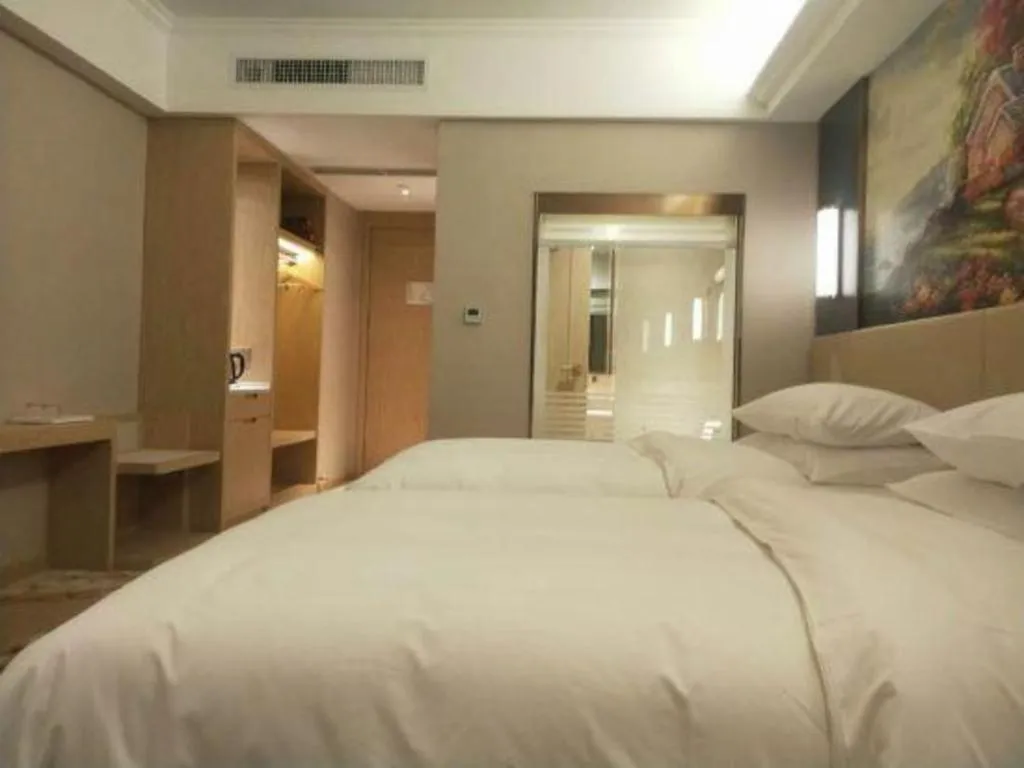 Bed in Vienna Hotel Yunnan Lijiang Ancient City