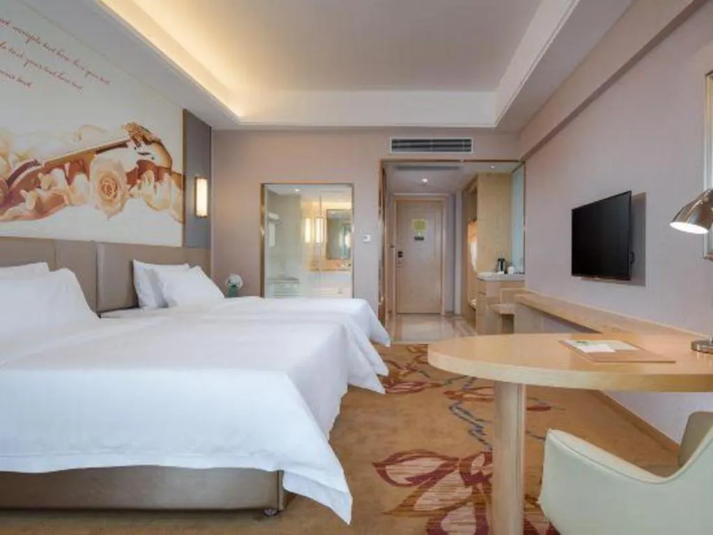 Bed in Vienna Hotel Yunnan Lijiang Ancient City